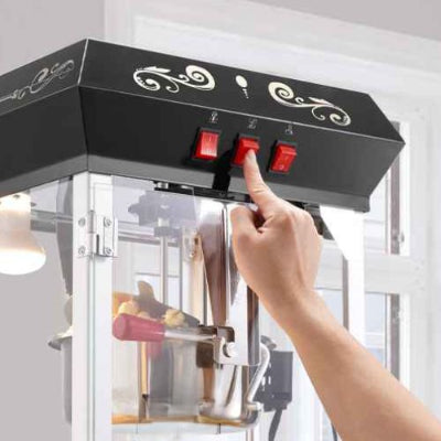 machine a pop corn montre trois interrupteurs
