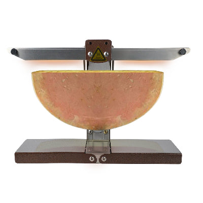 meule fromage sur appareil a raclette traditionnel