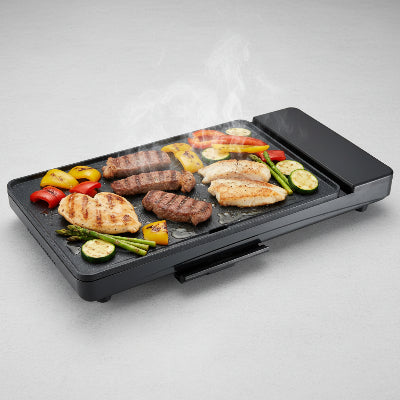 demonstration plancha electrique seule garnie nourriture