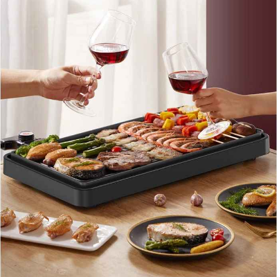 grill electrique plancha sur table garni nourriture
