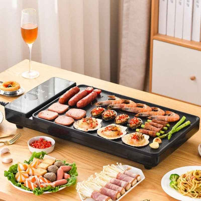plancha electrique garnie aliments sur table