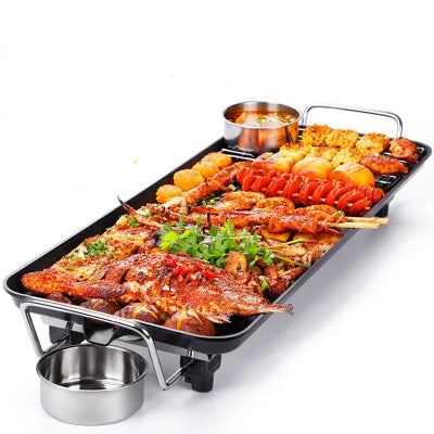 plancha electrique garnie nourriture avec bol deversement gras