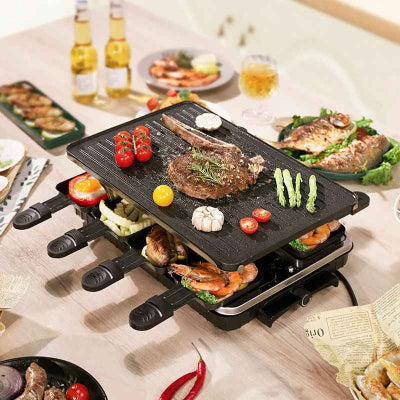 table garnie aliments avec appareil a raclette